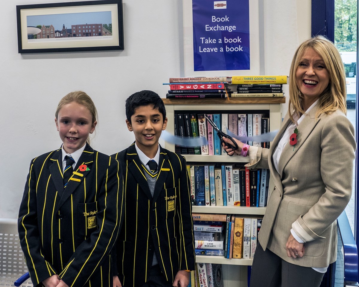 MP Esther McVey cuts a ribbon to launch the book swap