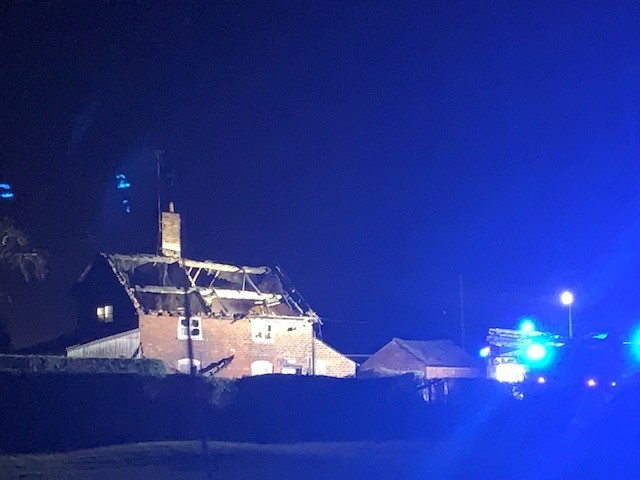 The gutted thatched roof of the cottage