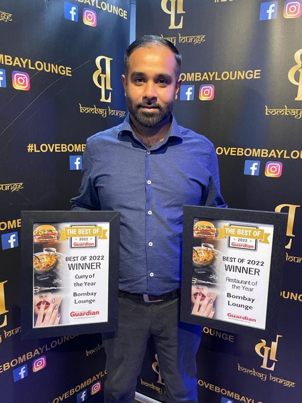 Bombay Lounge owner Afzal Hassan with the restaurants two Best of 2022 awards