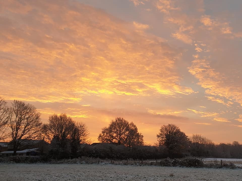 Snowy sunrise over Holmes Chapel by Candy Lean