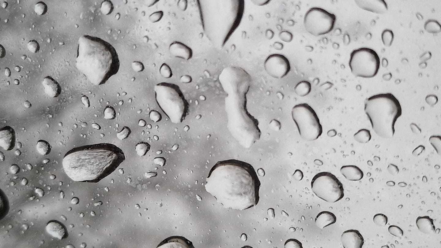 Raindrops on the sunroof by Cathie Leather